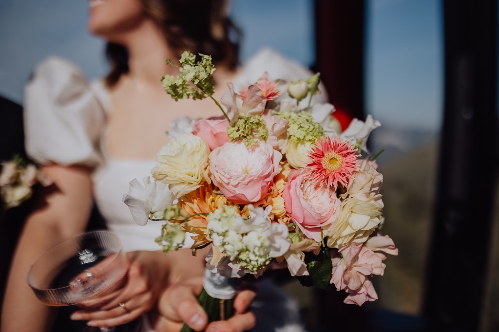 Spring bridal bouquet in detail during the gondola ride up the mountain