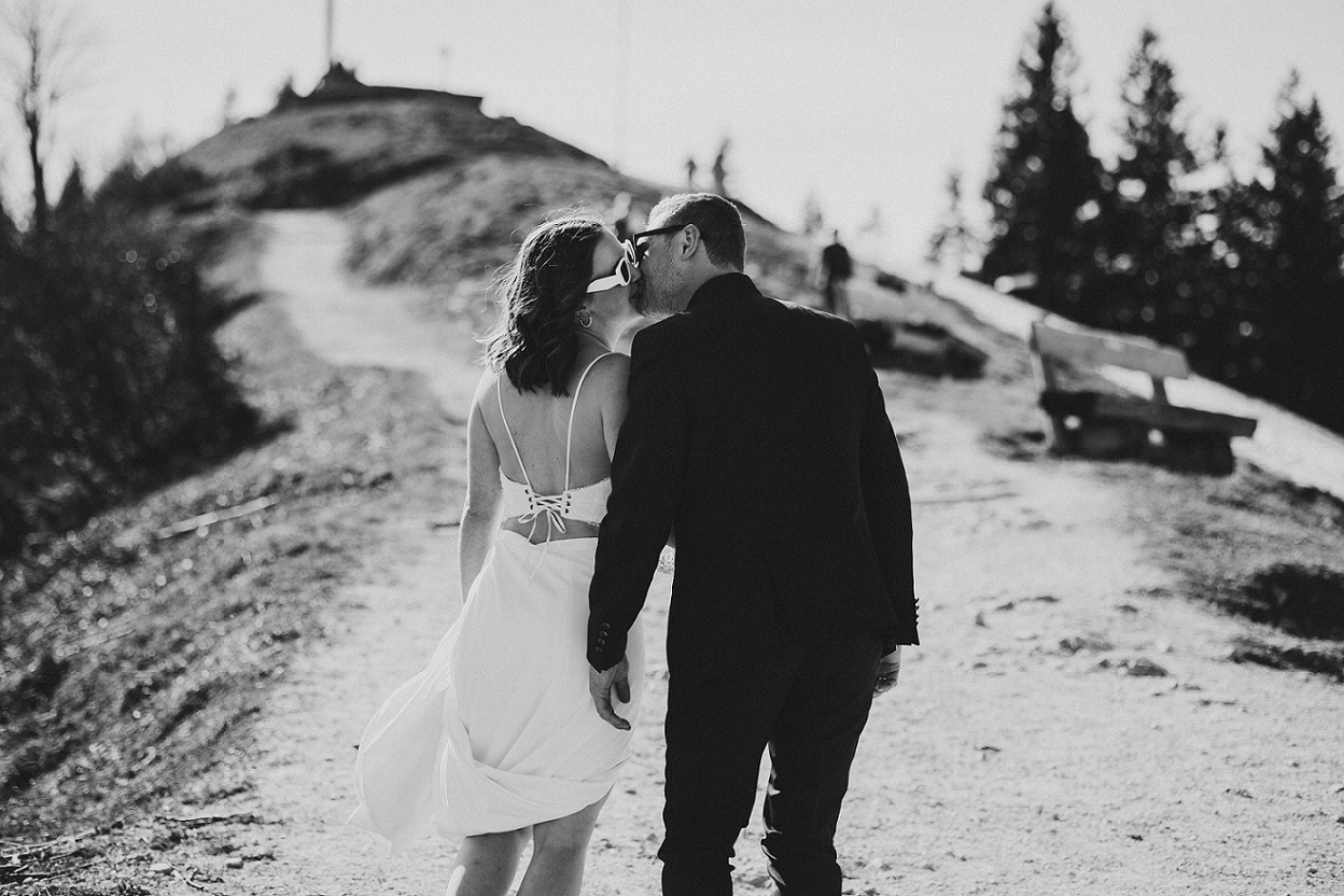 Bridal couple at their elopement in the Alps surrounded by mountains