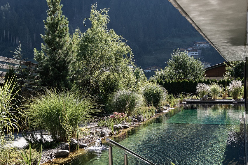 Natural lake at the Nesslerhof in Grossarl in Salzburger Land in the mountains